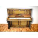 W. Biese, Berlin: a Victorian walnut upright overstrung piano.