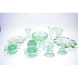 A collection of North East and other pressed green glass ware.