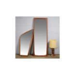 Two wall mirrors; and a table lamp.