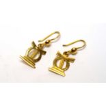 A pair of 18ct yellow gold Ashanti headrest style earrings,