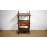 A Victorian rosewood three-tier whatnot.
