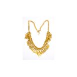 A high carat yellow gold fringe necklace.