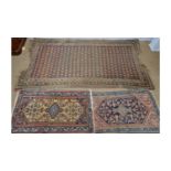 A Turkish rug; and two others.