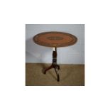 A late 19th Century satinwood and marquetry tripod table.