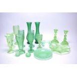 A collection of North East pressed green glass ware.