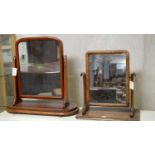 Two Victorian mahogany framed swing mirrors.