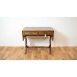 A 20th Century Regency revival crossbanded mahogany sofa table