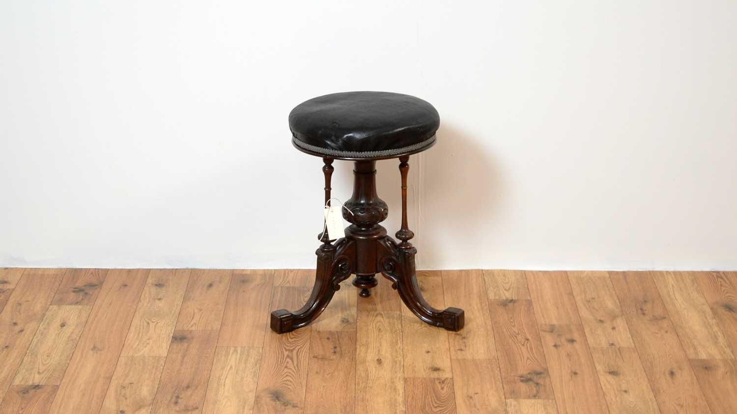 A Victorian mahogany piano stool