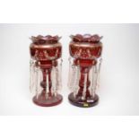 A pair of Victorian cranberry glass lustres.