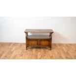 A 20th Century Jacobean Revival oak monks bench