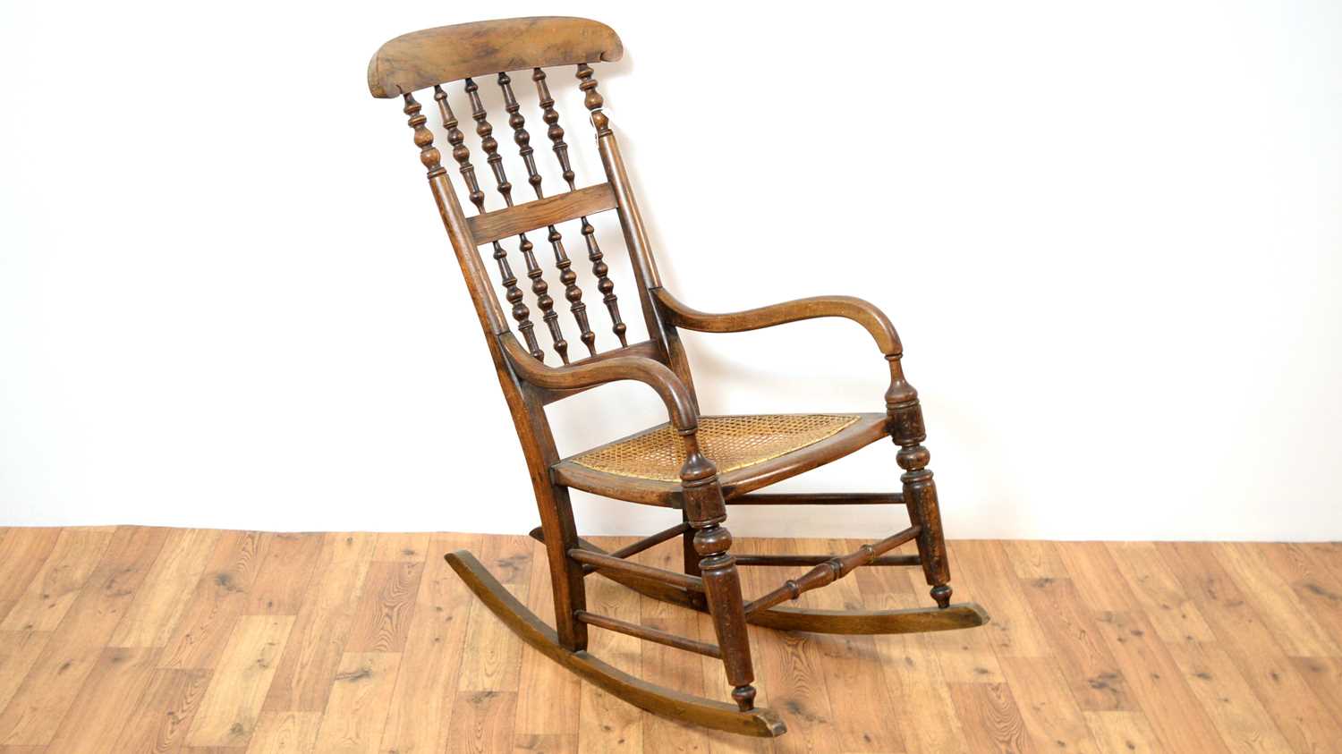 A 20th Century beech and elm rocking chair.