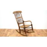 A 20th Century beech and elm rocking chair.