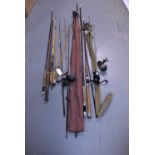 A selection of fishing rods and reels.