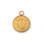 A 9ct yellow gold North East Automobile Association medal,