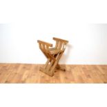 A 20th Century oak folding 'X'/Bishops chair