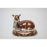 A Royal Crown Derby Collectors Guild Exclusive fawn paperweight or figure.