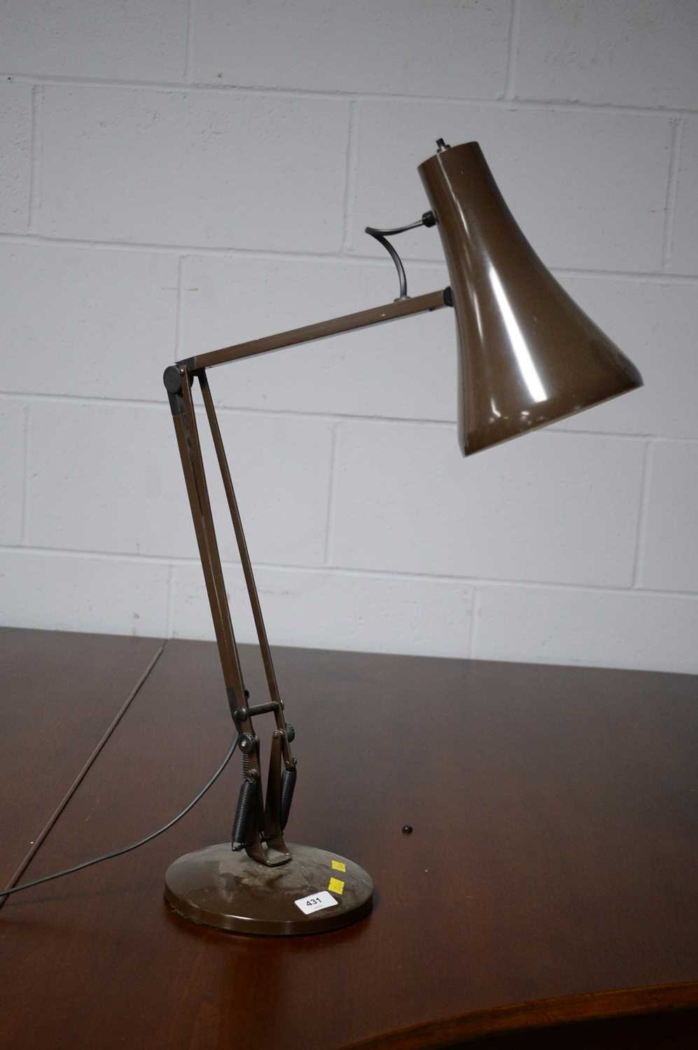 An Anglepoise desk lamp, in brown.