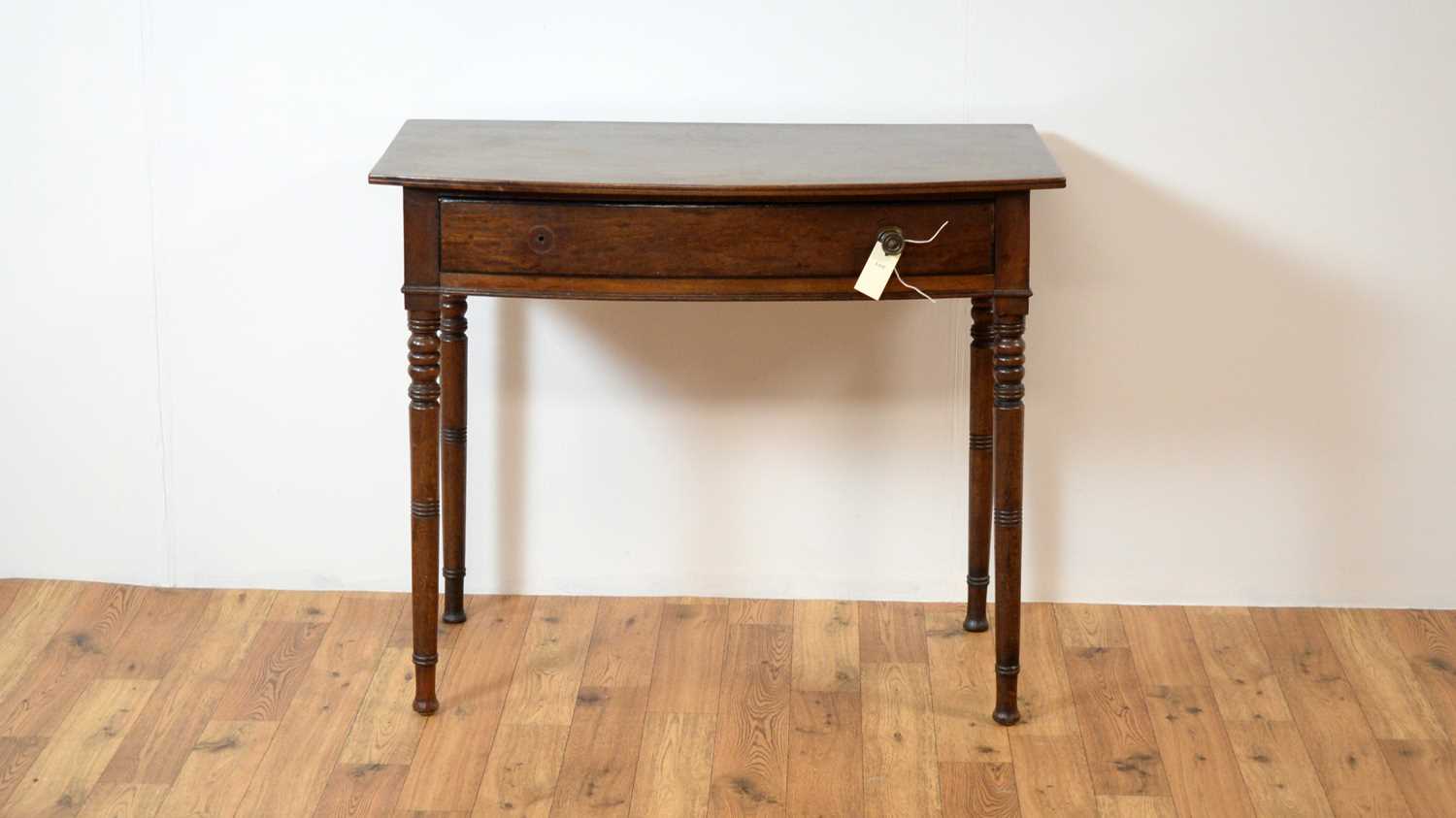 A 19th century bowfront side / hall table