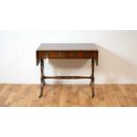 A reproduction Regency-style inlaid mahogany sofa table