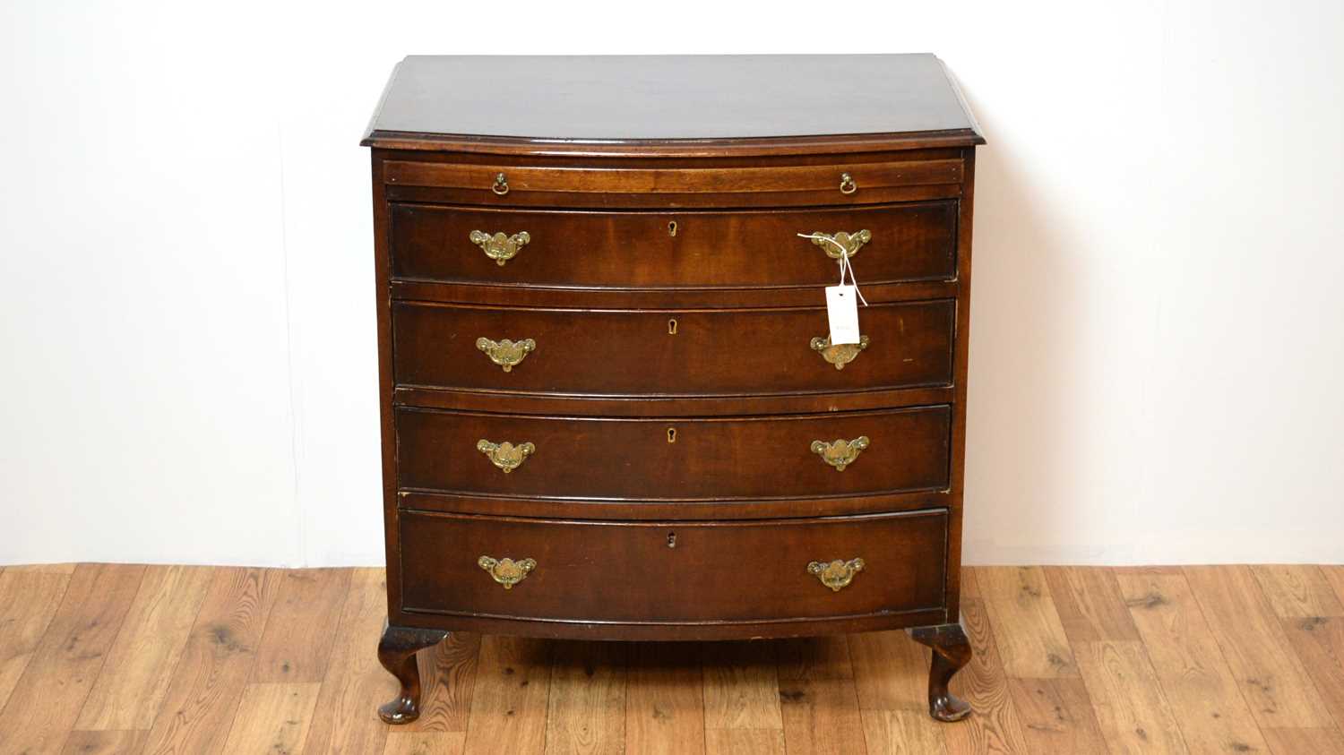 A 20th Century Georgian-style bachelors mahogany bow chest of drawers