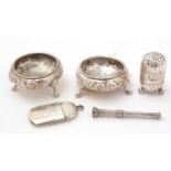 Silver table salts and other items.