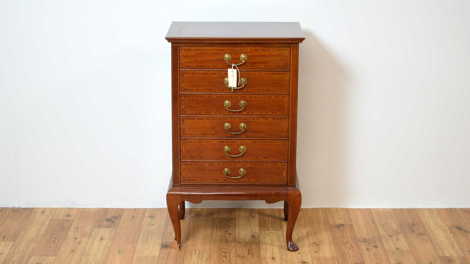 An early 20th Century inlaid mahogany music cabinet