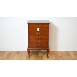 An early 20th Century inlaid mahogany music cabinet