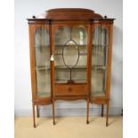 An early 20th Century Edwardian inverted breakfront china display cabinet