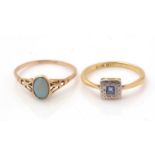 A sapphire ring and an opal ring