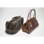 An antique leather Gladstone bag, and a 1960s lady’s Garfield's handbag.