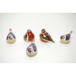 A collection of Royal Crown Derby ceramic bird paperweights.