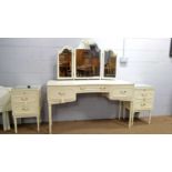 Mid Century cream and white painted French-style bedroom furniture.