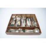 A wooden cutlery box containing a large quantity of electroplate flatware.