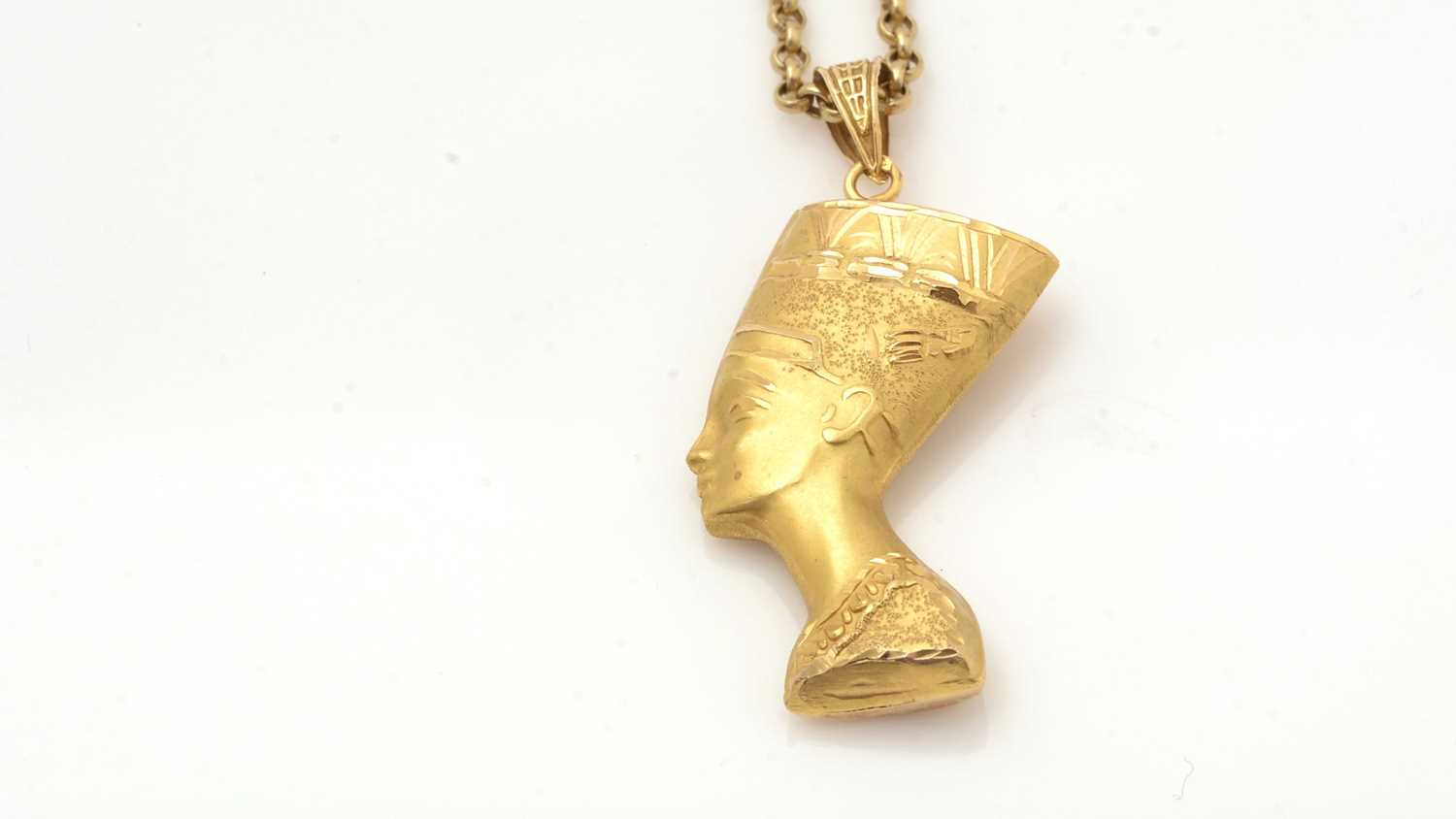 A gold Queen Nefertiti pendant on chain