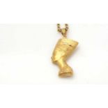 A gold Queen Nefertiti pendant on chain