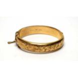 A 9ct yellow gold bangle,