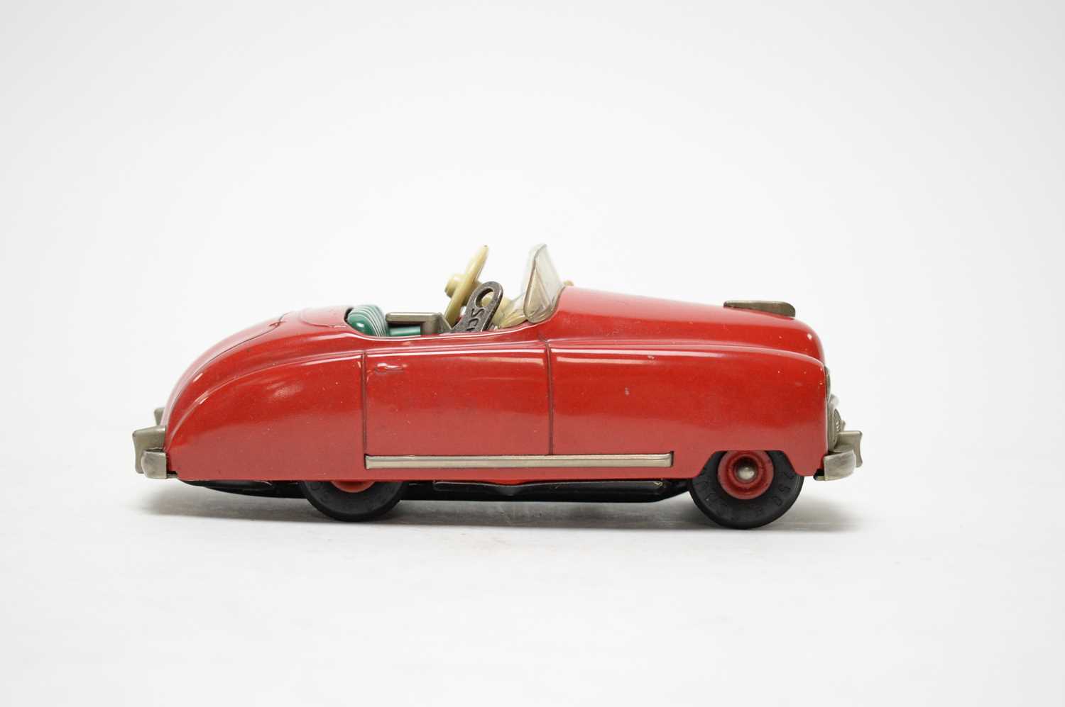 A Schuco Radio 4012, formed as a musical red tin plate clockwork car. - Image 2 of 3