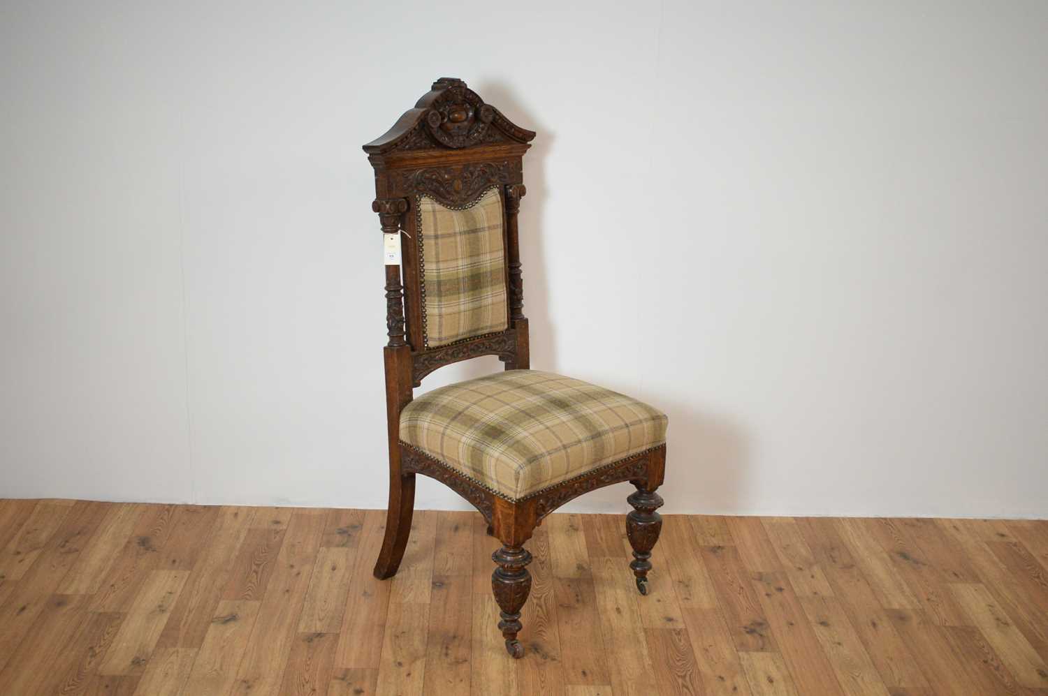 A late Victorian 19th Century oak high-backed chair