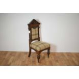 A late Victorian 19th Century oak high-backed chair