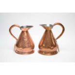A pair of Victorian copper harvest measure jugs.