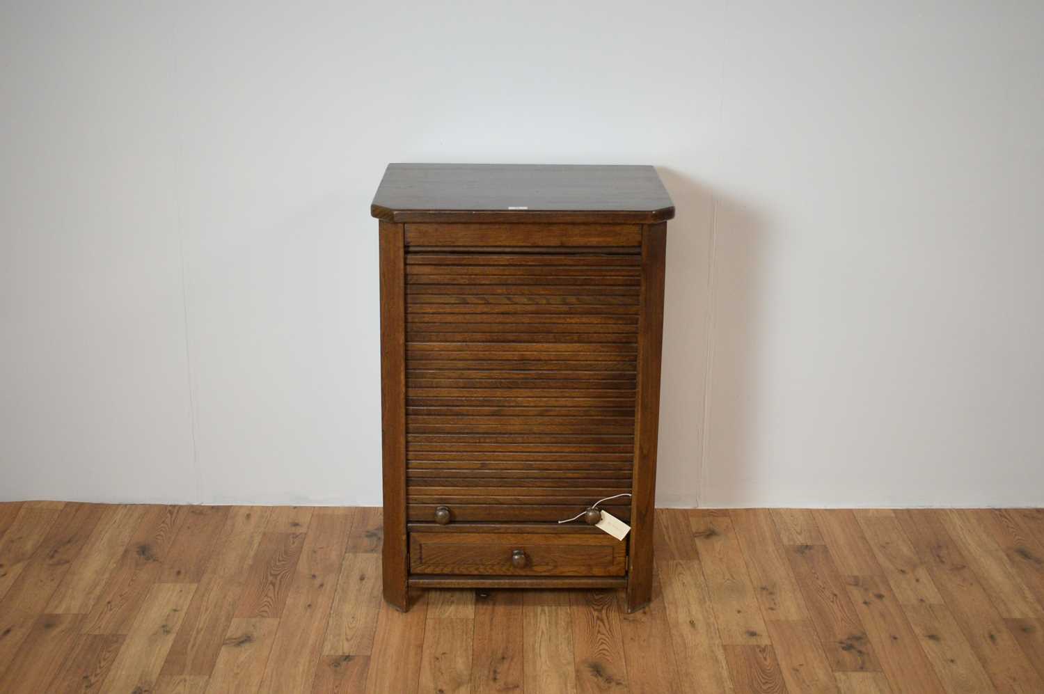A 20th Century oak tambour fronted pedestal chest/cabinet