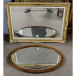 A 20th Century reproduction gilt framed wall mirror of rectangular form