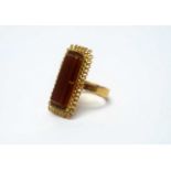 A carnelian and 18ct gold ring,