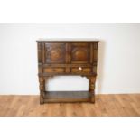 Manner of Titchmarsh & Goodwin: a Jacobean Revival oak cabinet on stand / buffet