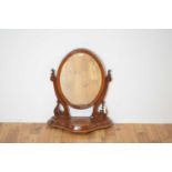 A large 19th Century Victorian mahogany framed toilet mirror of oval form