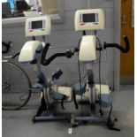 Two Thera Trainer Thera-Vital active-passive therapy trainer exercise machines.
