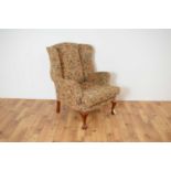 A 20th century wingback armchair