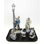 A Lladro ‘Lamplighter’ figure and others; and Nao figures.