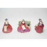 A collection of three Royal Doulton figures of ladies