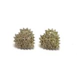 A pair of diamond earrings,